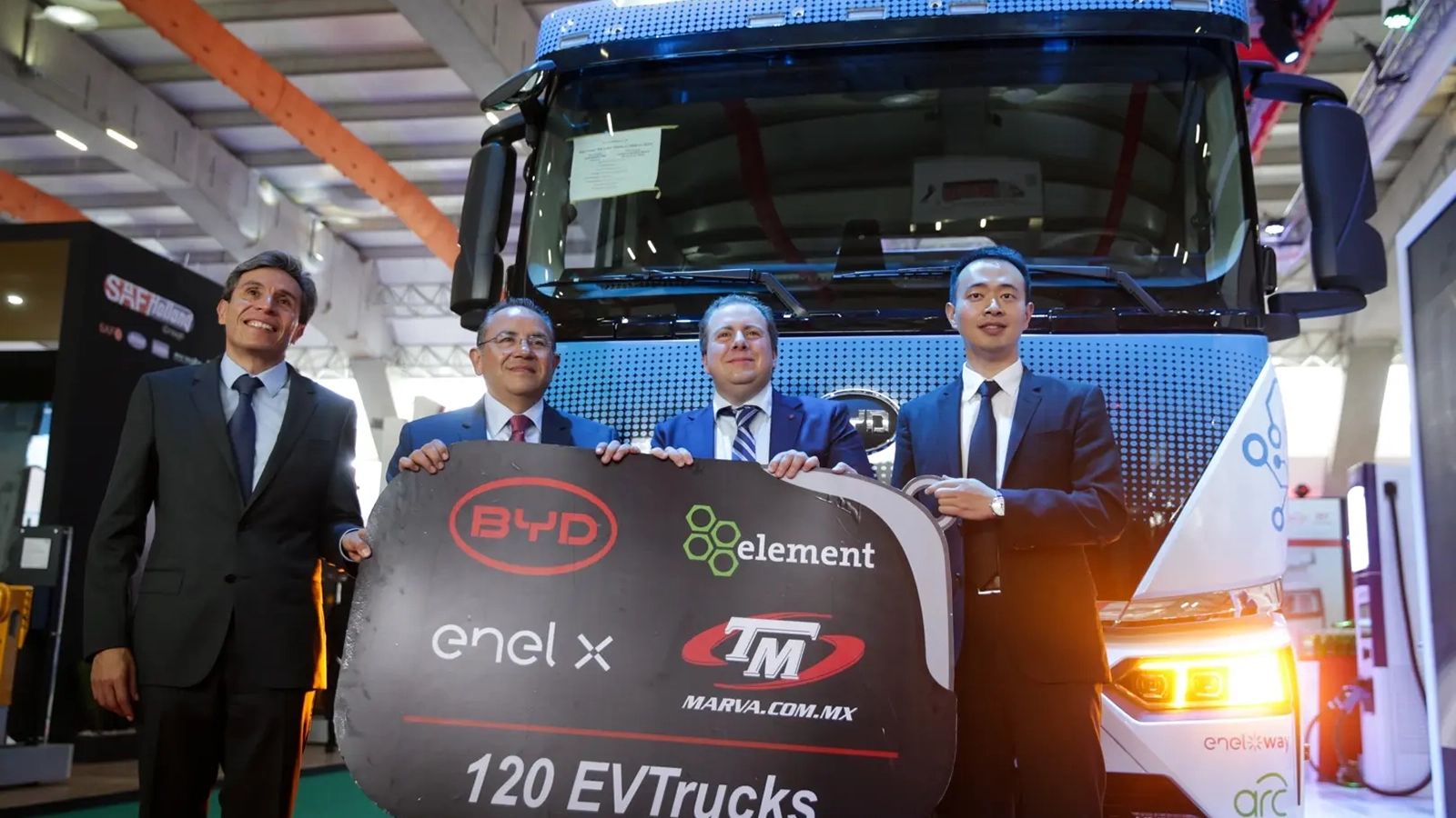 photo of byd element enel x and tm marva employees holding a sign