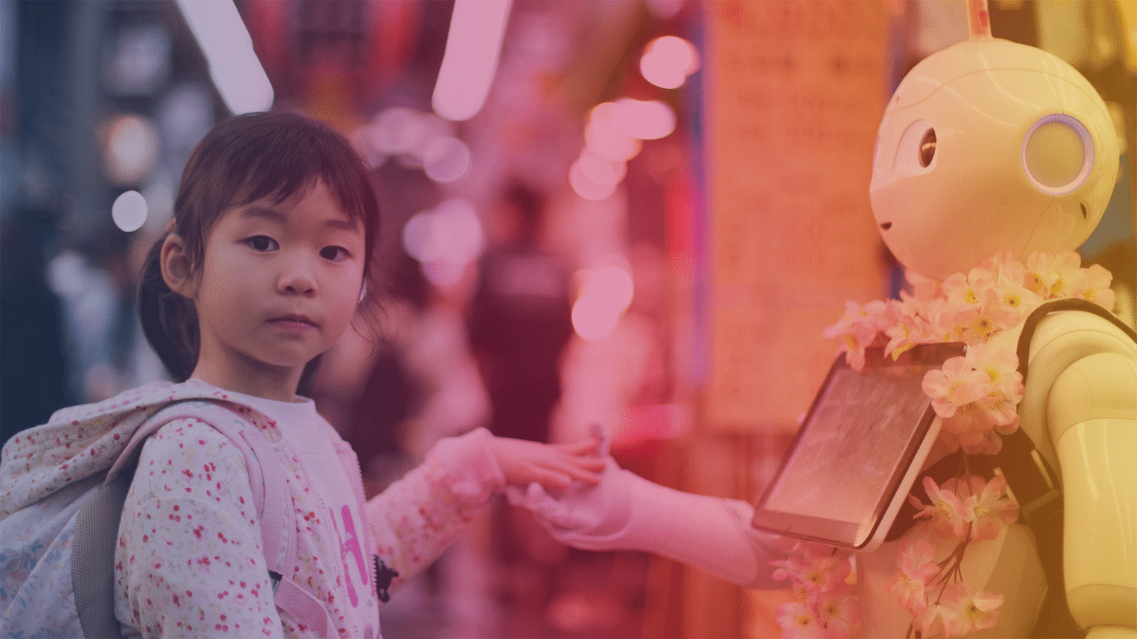 As Kuromon Market in Osaka was about to close for the evening I sampled some delicious king crab and did a final lap of the market when I stumbled upon one of the most Japanese scenes I could possibly imagine, a little girl, making friends with a robot.