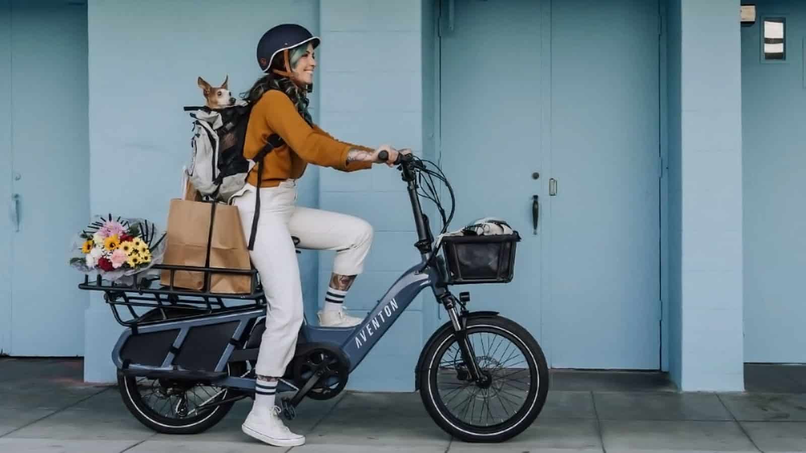 Aventon Abound shows cargo ability with woman riding with dog