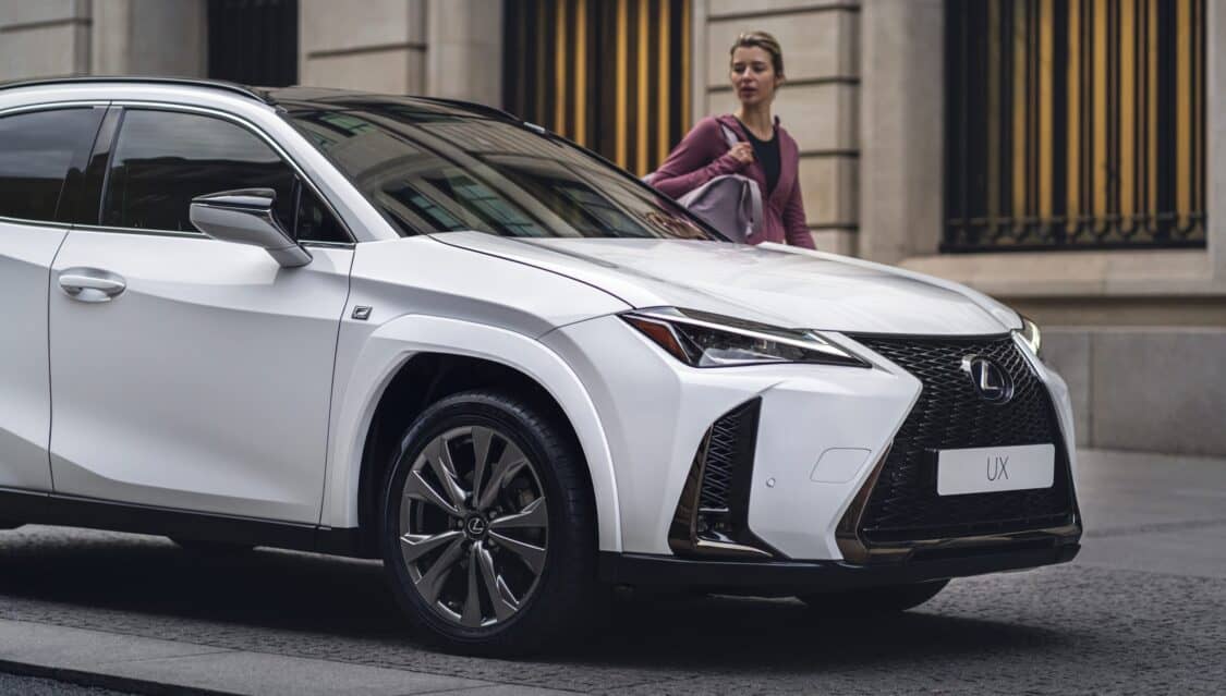 2024 Lexus UX 250h front 1/4 view with woman