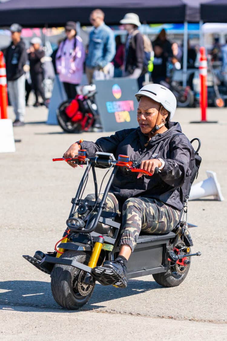 Photo of an attendee on an electric scooter for a test ride at Electrify Expo