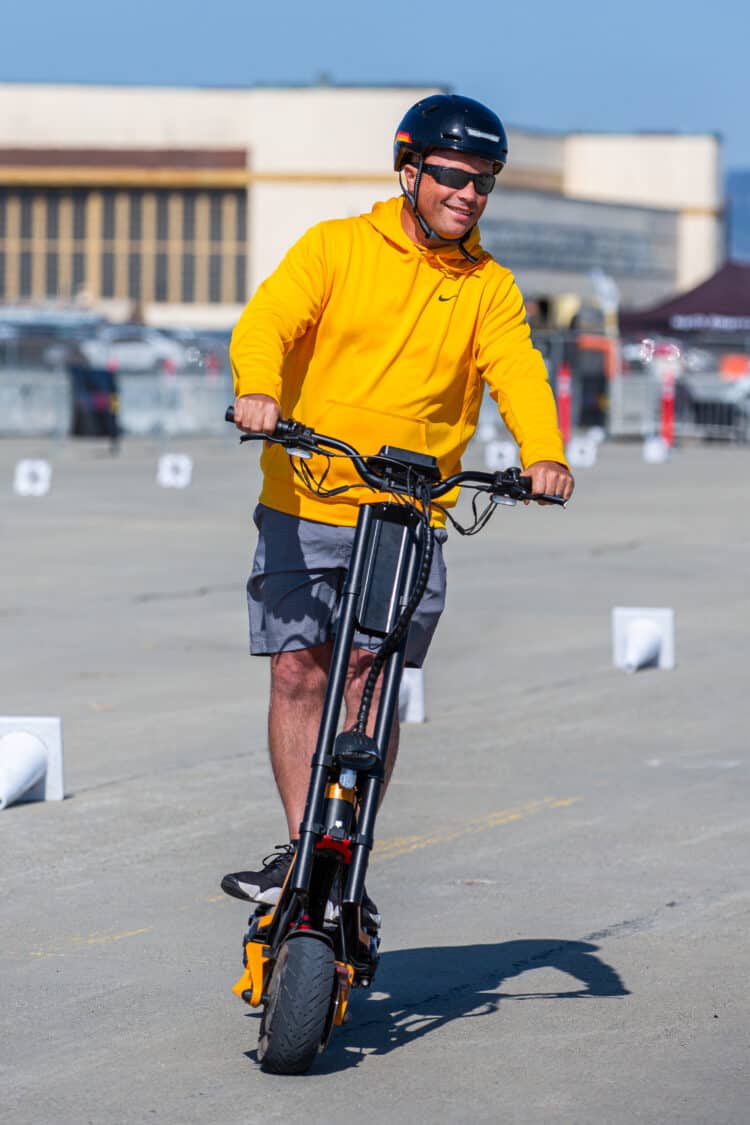 Photo of an attendee on an electric scooter for a test ride at Electrify Expo