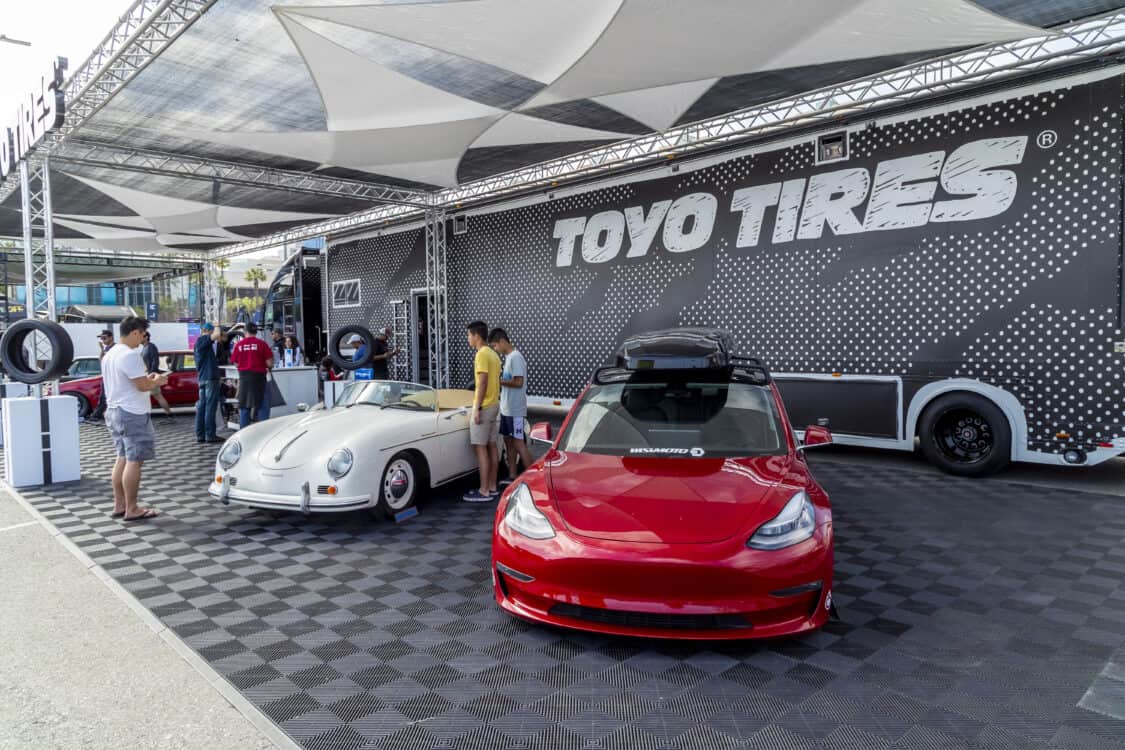 Toyo Tire Bisimoto Porsche Tesla - Electrify Showoff wows Long Beach with 100+ EVs, 40+ aftermarket exhibitors, electrified classics, and cutting-edge tech. Impressive lineup!