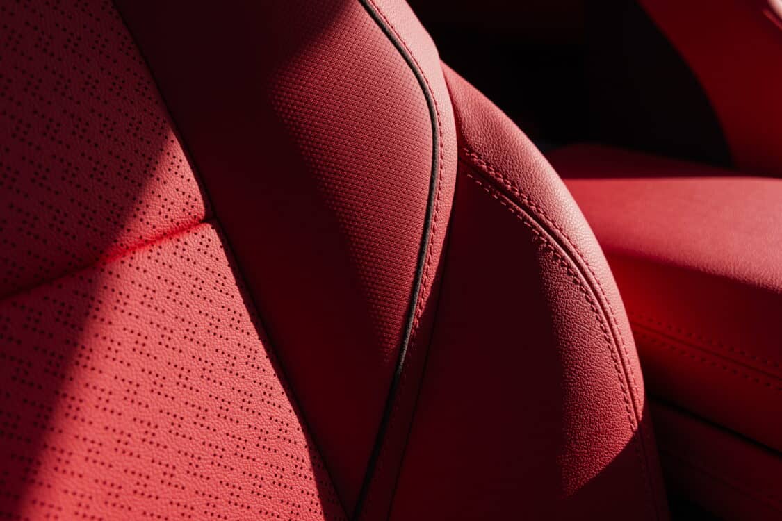 Photo of Close up of Adrenaline Red leather perforated seats in 2024 Chevrolet Blazer EV SS. Preproduction model shown. Actual production model may vary. 2024 Chevrolet Blazer EV available Spring 2023.
