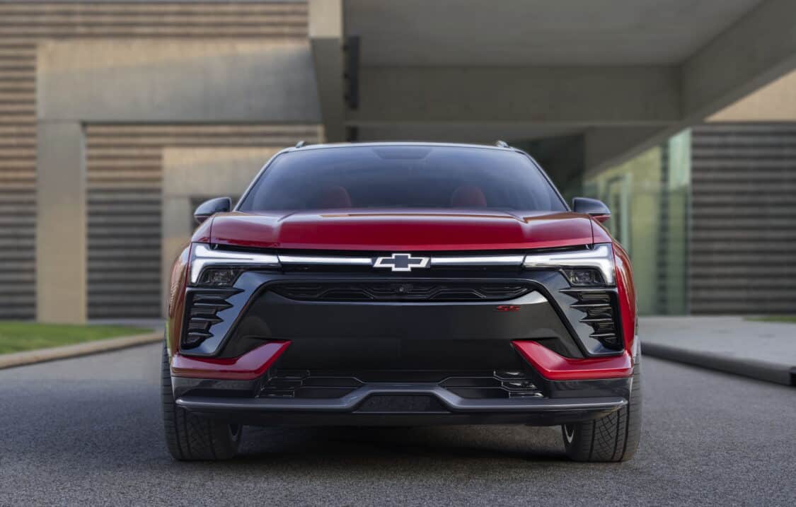 Photo of Front view of 2024 Chevrolet Blazer EV SS in Radiant Red Metallic with headlights illuminated. Preproduction model shown. Actual production model may vary. 2024 Chevrolet Blazer EV available Spring 2023.