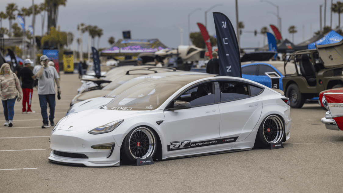 Photo of Americus Cuevas JDM VIP Bippu 2018 Tesla Model 3 LR RWD from Ruined EV modified with Thor Electronic Exhaust Management System (Dual), 12-Volt Battery (lithium) provided by Buddy Club USA – MEGALife Battery, 19” BBS LM Wheels, Yokohama Advan Sport V107 Tires - 235/35/19 (f), 255/35/19 (r), C7 6-Piston Brembo Brake Conversion/ 370 mm BBK by Don Marconi, Universal Air Suspension Struts, Air Lift 3P Management w/ 5 gal Seamless Air Tank, VIAIR 444c Compressors (2), LOSTAR Aluminum Magnesium Alloy Skid Plates, Artisan Spirits Sports Line Black Label EVS Widebody, WellVisors Window Visors, Carbon Fiber M3 Style Side Mirrors, Electric Speed Design Carbon Fiber Mud Guards, Electric Speed Design Carbon Fiber Door Handle Covers (Painted PPW), Electric Speed Design Carbon Fiber Side Marker Covers, Robot Craftsman Multi LED Taillights (1 of 2 in the world), LowGlow Undercar LED Kit, Ghozt Lighting Module, AutoFasion Window Curtains, Broadway Mirror 300mm Convex Wide, Junction Produce Carbon VIP Tables, Junction Produce Tsuna Knot (Silver), Junction Produce Fusa Shield Emblem (Bronze), Junction Produce Katana Shift Knob 20cm (Black), Junction Produce Hannya Charm (Red Mask), Junction Produce Kyoto Fan (Black/Red), Junction Produce Tissue Box Cover (Black), Junction Produce Crystal Ashtray (Round), Junction Produce Throw Pillow Cushion (Black), Junction Produce Seat Cushion (Black), Junction Produce Missions Neck Pad V1 (Black), Junction Produce x DAD VIP Air Freshener (Crown), Air Spencer Squash x4, Electric Speed Design Carbon Fiber Dash, Electric Speed Design Carbon Fiber Window and Door Switch Kit, Electric Speed Design Carbon Fiber Center Console kit, Electric Speed Design Carbon Fiber Armrest Cover, Electric Speed Design Carbon Fiber Dome Light Covers, Electric Speed Design Carbon Fiber Stalk Covers, Inch Empire Seat and Flooring (Wine Red), Aroham D-Line Yoke Steering Wheel, Opelite Optics 600 Stars with shooting stars, Suede headliner reupholstery, Orella Acoustics Tesla Model 3 Speaker Upgrade, Hansshow 7.2” Rear Entertainment & Climate Control Display