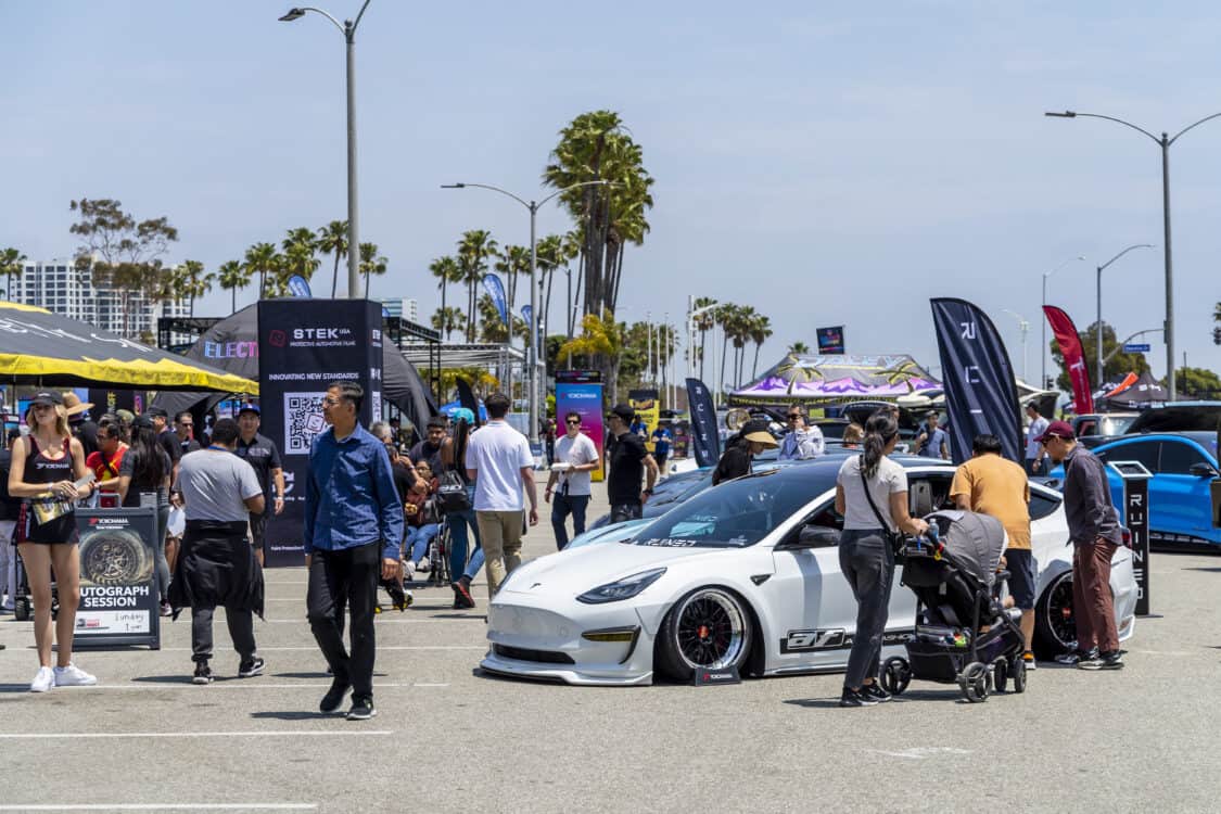 Photo of Americus Cuevas JDM VIP Bippu 2018 Tesla Model 3 LR RWD from Ruined EV modified with Thor Electronic Exhaust Management System (Dual), 12-Volt Battery (lithium) provided by Buddy Club USA – MEGALife Battery, 19” BBS LM Wheels, Yokohama Advan Sport V107 Tires - 235/35/19 (f), 255/35/19 (r), C7 6-Piston Brembo Brake Conversion/ 370 mm BBK by Don Marconi, Universal Air Suspension Struts, Air Lift 3P Management w/ 5 gal Seamless Air Tank, VIAIR 444c Compressors (2), LOSTAR Aluminum Magnesium Alloy Skid Plates, Artisan Spirits Sports Line Black Label EVS Widebody, WellVisors Window Visors, Carbon Fiber M3 Style Side Mirrors, Electric Speed Design Carbon Fiber Mud Guards, Electric Speed Design Carbon Fiber Door Handle Covers (Painted PPW), Electric Speed Design Carbon Fiber Side Marker Covers, Robot Craftsman Multi LED Taillights (1 of 2 in the world), LowGlow Undercar LED Kit, Ghozt Lighting Module, AutoFasion Window Curtains, Broadway Mirror 300mm Convex Wide, Junction Produce Carbon VIP Tables, Junction Produce Tsuna Knot (Silver), Junction Produce Fusa Shield Emblem (Bronze), Junction Produce Katana Shift Knob 20cm (Black), Junction Produce Hannya Charm (Red Mask), Junction Produce Kyoto Fan (Black/Red), Junction Produce Tissue Box Cover (Black), Junction Produce Crystal Ashtray (Round), Junction Produce Throw Pillow Cushion (Black), Junction Produce Seat Cushion (Black), Junction Produce Missions Neck Pad V1 (Black), Junction Produce x DAD VIP Air Freshener (Crown), Air Spencer Squash x4, Electric Speed Design Carbon Fiber Dash, Electric Speed Design Carbon Fiber Window and Door Switch Kit, Electric Speed Design Carbon Fiber Center Console kit, Electric Speed Design Carbon Fiber Armrest Cover, Electric Speed Design Carbon Fiber Dome Light Covers, Electric Speed Design Carbon Fiber Stalk Covers, Inch Empire Seat and Flooring (Wine Red), Aroham D-Line Yoke Steering Wheel, Opelite Optics 600 Stars with shooting stars, Suede headliner reupholstery, Orella Acoustics Tesla Model 3 Speaker Upgrade, Hansshow 7.2” Rear Entertainment & Climate Control Display