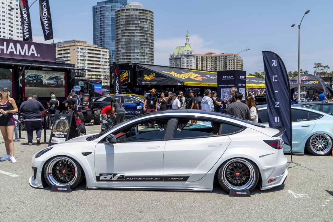 Photo of Americus Cuevas JDM VIP Bippu 2018 Tesla Model 3 LR RWD from Ruined EV modified with Thor Electronic Exhaust Management System (Dual), 12-Volt Battery (lithium) provided by Buddy Club USA – MEGALife Battery, 19” BBS LM Wheels, Yokohama Advan Sport V107 Tires - 235/35/19 (f), 255/35/19 (r), C7 6-Piston Brembo Brake Conversion/ 370 mm BBK by Don Marconi, Universal Air Suspension Struts, Air Lift 3P Management w/ 5 gal Seamless Air Tank, VIAIR 444c Compressors (2), LOSTAR Aluminum Magnesium Alloy Skid Plates, Artisan Spirits Sports Line Black Label EVS Widebody, WellVisors Window Visors, Carbon Fiber M3 Style Side Mirrors, Electric Speed Design Carbon Fiber Mud Guards, Electric Speed Design Carbon Fiber Door Handle Covers (Painted PPW), Electric Speed Design Carbon Fiber Side Marker Covers, Robot Craftsman Multi LED Taillights (1 of 2 in the world), LowGlow Undercar LED Kit, Ghozt Lighting Module, AutoFasion Window Curtains, Broadway Mirror 300mm Convex Wide, Junction Produce Carbon VIP Tables, Junction Produce Tsuna Knot (Silver), Junction Produce Fusa Shield Emblem (Bronze), Junction Produce Katana Shift Knob 20cm (Black), Junction Produce Hannya Charm (Red Mask), Junction Produce Kyoto Fan (Black/Red), Junction Produce Tissue Box Cover (Black), Junction Produce Crystal Ashtray (Round), Junction Produce Throw Pillow Cushion (Black), Junction Produce Seat Cushion (Black), Junction Produce Missions Neck Pad V1 (Black), Junction Produce x DAD VIP Air Freshener (Crown), Air Spencer Squash x4, Electric Speed Design Carbon Fiber Dash, Electric Speed Design Carbon Fiber Window and Door Switch Kit, Electric Speed Design Carbon Fiber Center Console kit, Electric Speed Design Carbon Fiber Armrest Cover, Electric Speed Design Carbon Fiber Dome Light Covers, Electric Speed Design Carbon Fiber Stalk Covers, Inch Empire Seat and Flooring (Wine Red), Aroham D-Line Yoke Steering Wheel, Opelite Optics 600 Stars with shooting stars, Suede headliner reupholstery, Orella Acoustics Tesla Model 3 Speaker Upgrade, Hansshow 7.2” Rear Entertainment & Climate Control Display