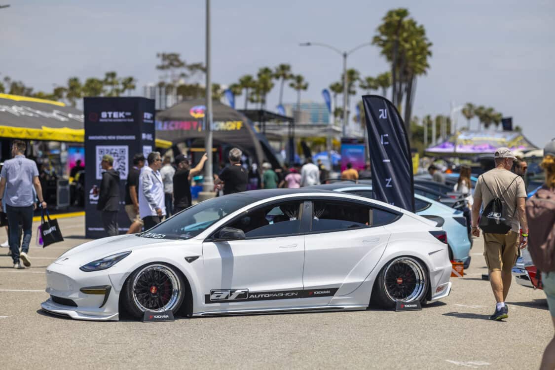 Photo of Americus Cuevas JDM VIP Bippu 2018 Tesla Model 3 LR RWD from Ruined EV modified with Thor Electronic Exhaust Management System (Dual), 12-Volt Battery (lithium) provided by Buddy Club USA – MEGALife Battery, 19” BBS LM Wheels, Yokohama Advan Sport V107 Tires - 235/35/19 (f), 255/35/19 (r), C7 6-Piston Brembo Brake Conversion/ 370 mm BBK by Don Marconi, Universal Air Suspension Struts, Air Lift 3P Management w/ 5 gal Seamless Air Tank, VIAIR 444c Compressors (2), LOSTAR Aluminum Magnesium Alloy Skid Plates, Artisan Spirits Sports Line Black Label EVS Widebody, WellVisors Window Visors, Carbon Fiber M3 Style Side Mirrors, Electric Speed Design Carbon Fiber Mud Guards, Electric Speed Design Carbon Fiber Door Handle Covers (Painted PPW), Electric Speed Design Carbon Fiber Side Marker Covers, Robot Craftsman Multi LED Taillights (1 of 2 in the world), LowGlow Undercar LED Kit, Ghozt Lighting Module, AutoFasion Window Curtains, Broadway Mirror 300mm Convex Wide, Junction Produce Carbon VIP Tables, Junction Produce Tsuna Knot (Silver), Junction Produce Fusa Shield Emblem (Bronze), Junction Produce Katana Shift Knob 20cm (Black), Junction Produce Hannya Charm (Red Mask), Junction Produce Kyoto Fan (Black/Red), Junction Produce Tissue Box Cover (Black), Junction Produce Crystal Ashtray (Round), Junction Produce Throw Pillow Cushion (Black), Junction Produce Seat Cushion (Black), Junction Produce Missions Neck Pad V1 (Black), Junction Produce x DAD VIP Air Freshener (Crown), Air Spencer Squash x4, Electric Speed Design Carbon Fiber Dash, Electric Speed Design Carbon Fiber Window and Door Switch Kit, Electric Speed Design Carbon Fiber Center Console kit, Electric Speed Design Carbon Fiber Armrest Cover, Electric Speed Design Carbon Fiber Dome Light Covers, Electric Speed Design Carbon Fiber Stalk Covers, Inch Empire Seat and Flooring (Wine Red), Aroham D-Line Yoke Steering Wheel, Opelite Optics 600 Stars with shooting stars, Suede headliner reupholstery, Orella Acoustics Tesla Model 3 Speaker Upgrade, Hansshow 7.2” Rear Entertainment & Climate Control Display