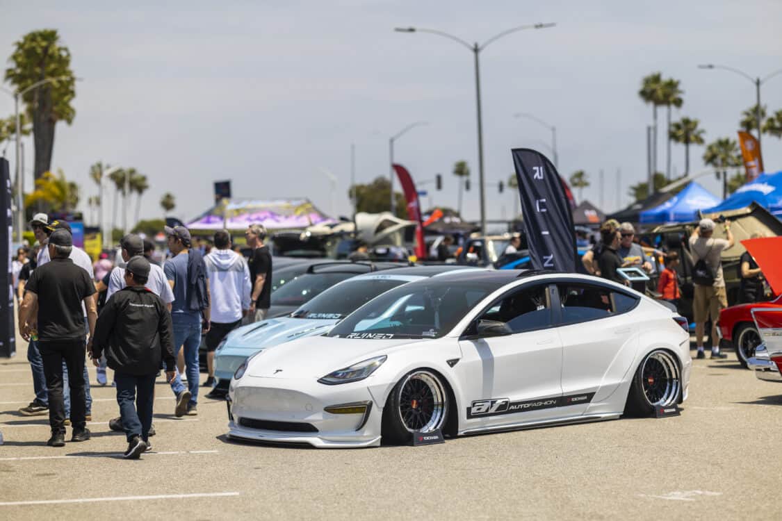 Photo of Americus Cuevas JDM VIP Bippu 2018 Tesla Model 3 LR RWD from Ruined EV modified with Thor Electronic Exhaust Management System (Dual), 12-Volt Battery (lithium) provided by Buddy Club USA – MEGALife Battery, 19” BBS LM Wheels, Yokohama Advan Sport V107 Tires - 235/35/19 (f), 255/35/19 (r), C7 6-Piston Brembo Brake Conversion/ 370 mm BBK by Don Marconi, Universal Air Suspension Struts, Air Lift 3P Management w/ 5 gal Seamless Air Tank, VIAIR 444c Compressors (2), LOSTAR Aluminum Magnesium Alloy Skid Plates, Artisan Spirits Sports Line Black Label EVS Widebody, WellVisors Window Visors, Carbon Fiber M3 Style Side Mirrors, Electric Speed Design Carbon Fiber Mud Guards, Electric Speed Design Carbon Fiber Door Handle Covers (Painted PPW), Electric Speed Design Carbon Fiber Side Marker Covers, Robot Craftsman Multi LED Taillights (1 of 2 in the world), LowGlow Undercar LED Kit, Ghozt Lighting Module, AutoFasion Window Curtains, Broadway Mirror 300mm Convex Wide, Junction Produce Carbon VIP Tables, Junction Produce Tsuna Knot (Silver), Junction Produce Fusa Shield Emblem (Bronze), Junction Produce Katana Shift Knob 20cm (Black), Junction Produce Hannya Charm (Red Mask), Junction Produce Kyoto Fan (Black/Red), Junction Produce Tissue Box Cover (Black), Junction Produce Crystal Ashtray (Round), Junction Produce Throw Pillow Cushion (Black), Junction Produce Seat Cushion (Black), Junction Produce Missions Neck Pad V1 (Black), Junction Produce x DAD VIP Air Freshener (Crown), Air Spencer Squash x4, Electric Speed Design Carbon Fiber Dash, Electric Speed Design Carbon Fiber Window and Door Switch Kit, Electric Speed Design Carbon Fiber Center Console kit, Electric Speed Design Carbon Fiber Armrest Cover, Electric Speed Design Carbon Fiber Dome Light Covers, Electric Speed Design Carbon Fiber Stalk Covers, Inch Empire Seat and Flooring (Wine Red), Aroham D-Line Yoke Steering Wheel, Opelite Optics 600 Stars with shooting stars, Suede headliner reupholstery, Orella Acoustics Tesla Model 3 Speaker Upgrade, Hansshow 7.2” Rear Entertainment & Climate Control Display