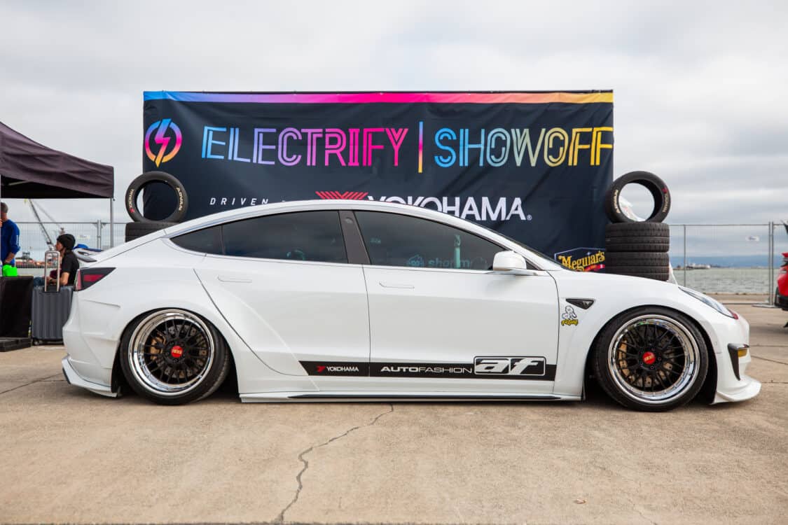 Photo of Americus Cuevas JDM VIP Bippu 2018 Tesla Model 3 LR RWD from Ruined EV modified with Thor Electronic Exhaust Management System (Dual), 
12-Volt Battery (lithium) provided by Buddy Club USA – MEGALife Battery, 19” BBS LM Wheels, Yokohama Advan Sport V107 Tires - 235/35/19 (f), 255/35/19 (r), C7 6-Piston Brembo Brake Conversion/ 370 mm BBK by Don Marconi, Universal Air Suspension Struts, Air Lift 3P Management w/ 5 gal Seamless Air Tank, VIAIR 444c Compressors (2), LOSTAR Aluminum Magnesium Alloy Skid Plates, Artisan Spirits Sports Line Black Label EVS Widebody, WellVisors Window Visors, Carbon Fiber M3 Style Side Mirrors, Electric Speed Design Carbon Fiber Mud Guards, Electric Speed Design Carbon Fiber Door Handle Covers (Painted PPW), Electric Speed Design Carbon Fiber Side Marker Covers, Robot Craftsman Multi LED Taillights (1 of 2 in the world), LowGlow Undercar LED Kit, Ghozt Lighting Module, AutoFasion Window Curtains, Broadway Mirror 300mm Convex Wide, Junction Produce Carbon VIP Tables, Junction Produce Tsuna Knot (Silver), Junction Produce Fusa Shield Emblem (Bronze), Junction Produce Katana Shift Knob 20cm (Black), Junction Produce Hannya Charm (Red Mask), Junction Produce Kyoto Fan (Black/Red), Junction Produce Tissue Box Cover (Black), Junction Produce Crystal Ashtray (Round), Junction Produce Throw Pillow Cushion (Black), Junction Produce Seat Cushion (Black), Junction Produce Missions Neck Pad V1 (Black), Junction Produce x DAD VIP Air Freshener (Crown), Air Spencer Squash x4, Electric Speed Design Carbon Fiber Dash, Electric Speed Design Carbon Fiber Window and Door Switch Kit, Electric Speed Design Carbon Fiber Center Console kit, Electric Speed Design Carbon Fiber Armrest Cover, Electric Speed Design Carbon Fiber Dome Light Covers, Electric Speed Design Carbon Fiber Stalk Covers, Inch Empire Seat and Flooring (Wine Red), Aroham D-Line Yoke Steering Wheel, Opelite Optics 600 Stars with shooting stars, Suede headliner reupholstery, Orella Acoustics Tesla Model 3 Speaker Upgrade, Hansshow 7.2” Rear Entertainment & Climate Control Display