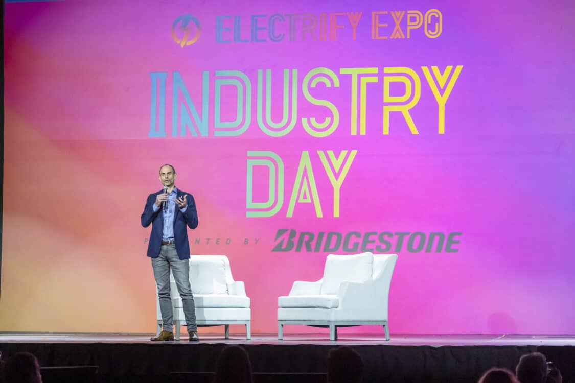 Photo of Will Robbins, Bridgestone Director of Consumer Product Strategy, speaking at Electrify Expo: Industry Day in Long Beach 2023