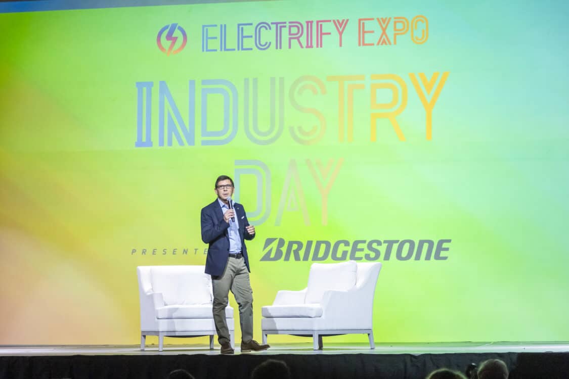 Photo of Riccardo Cichi, Bridgestone President & Chief Sales Officer, speaking at Electrify Expo: Industry Day 2023