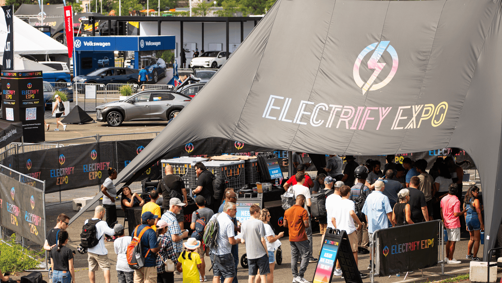 Photo of Electrify Expo in Washington DC. Over 13,000 demo rides! Attendees walking into the entrance of the show.