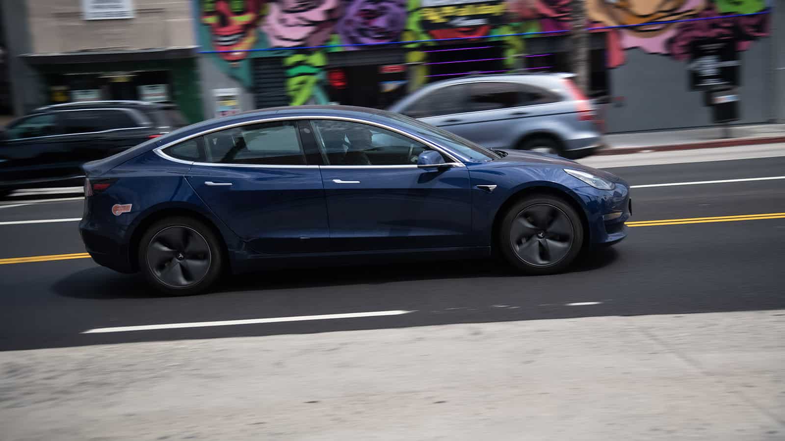 Photo of Tesla Model 3 on a paved road