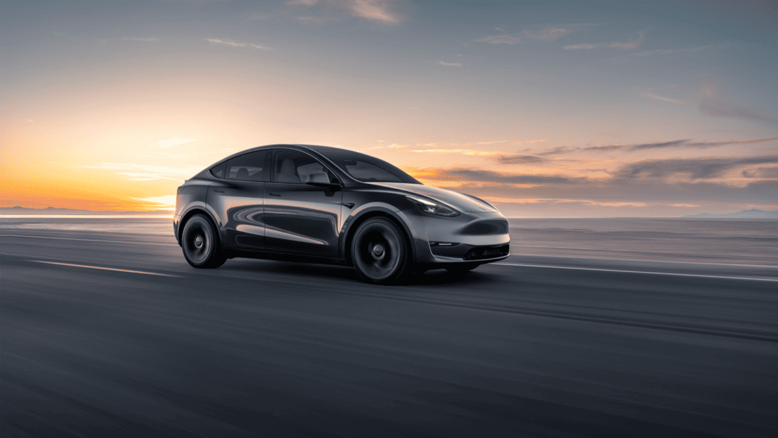Photo of 2023 Tesla Model Y front 3/4 view, driving on a paved road