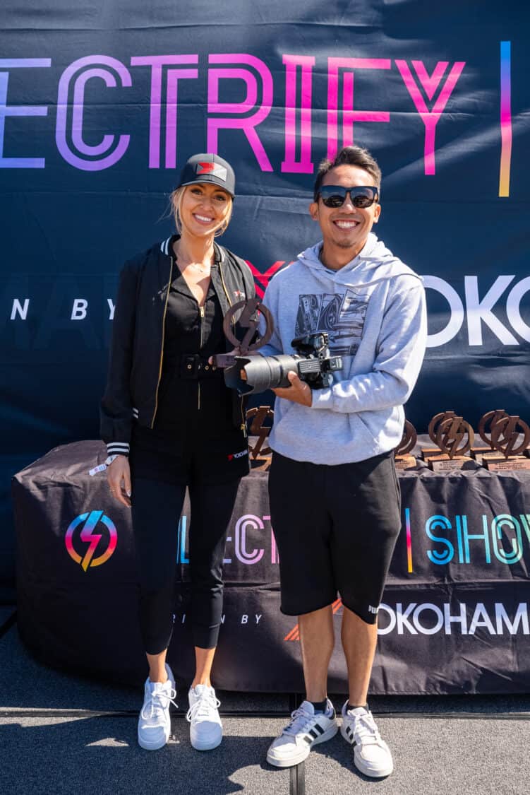 Photo of Perry Kwok receiving award for Best SUV for his 2020 Tesla Model Y at Electrify Showoff San Francisco