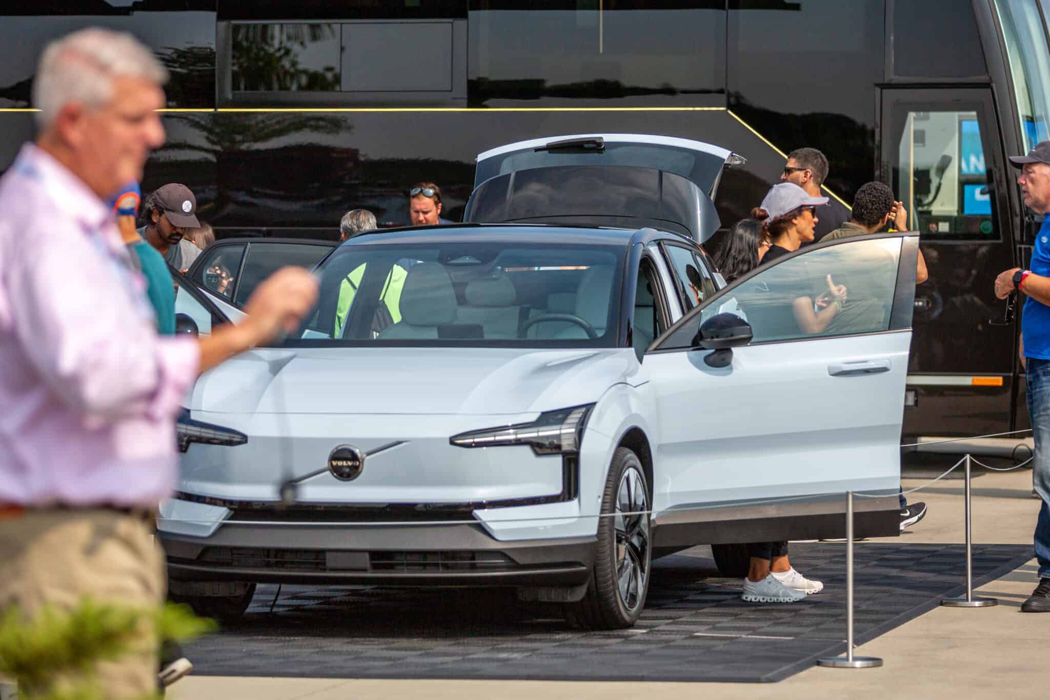 Photo of attendees looking at the features of a Volvo EX30 for the first time at Electrify Expo in New York