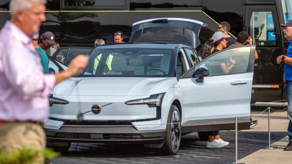 Photo of attendees looking at the features of a Volvo EX30 for the first time at Electrify Expo in New York