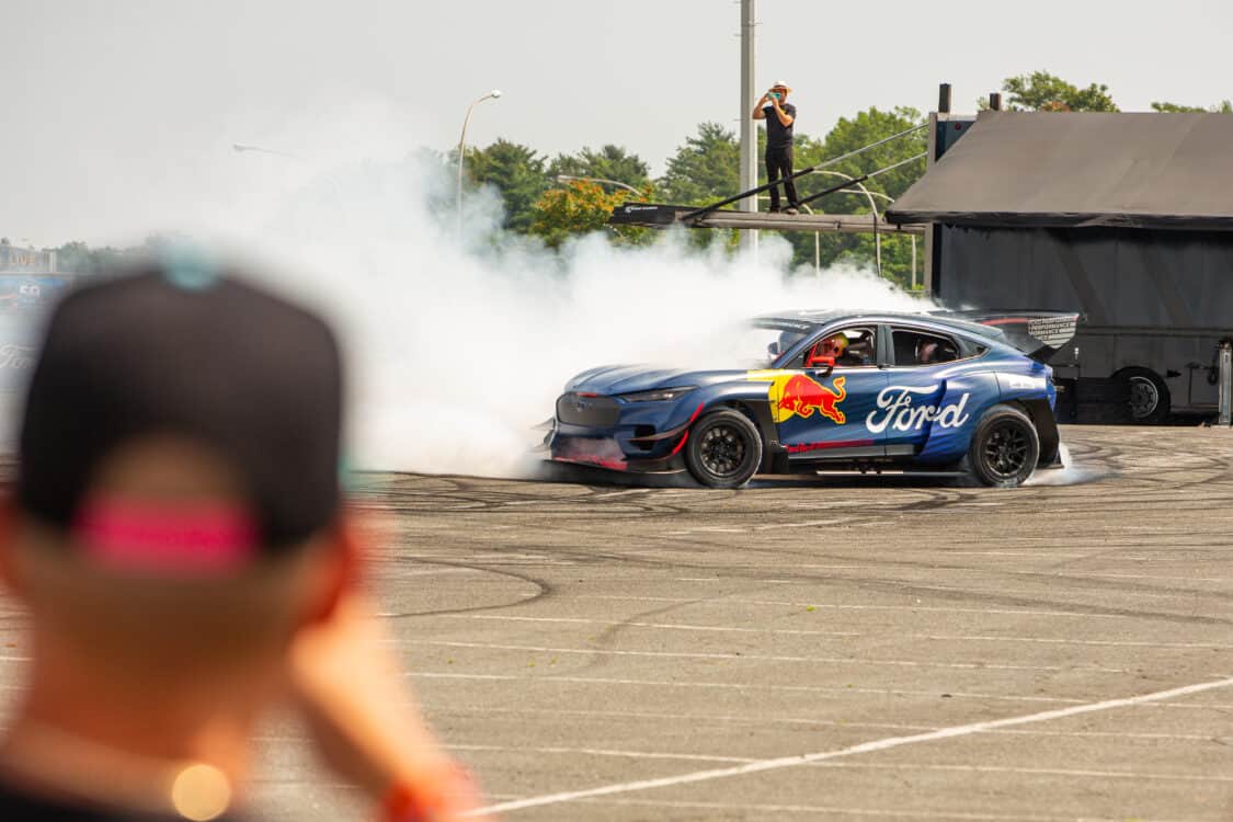 Photo of Collete Davis drifting the Ford Mustang Mach-E 1400 in the Ford Thrill Zone at Electrify Expo in New York