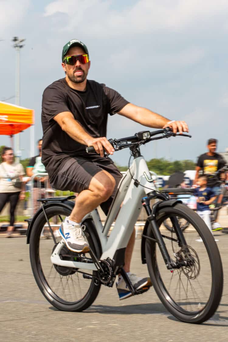 Photo of attendees test riding electric bikes at Electrify Expo in New York
