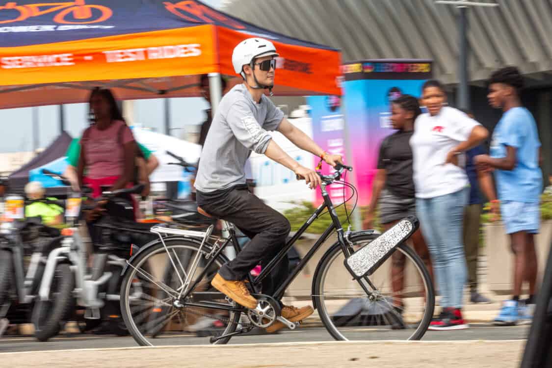 Photo of attendees test riding CLIP electric bikes at Electrify Expo in New York