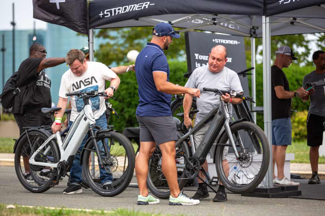 Photo of attendees test riding Stromer electric bikes at Electrify Expo in New York