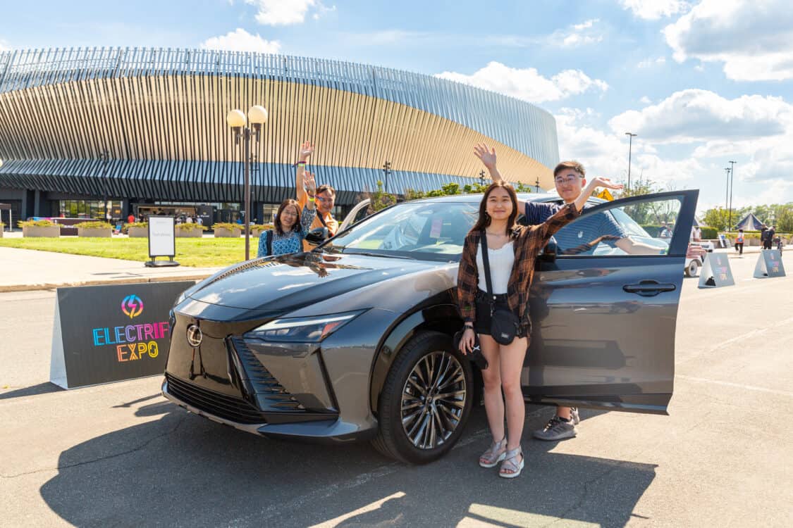 Photo of attendees test driving a Lexus RZ at Electrify Expo in New York