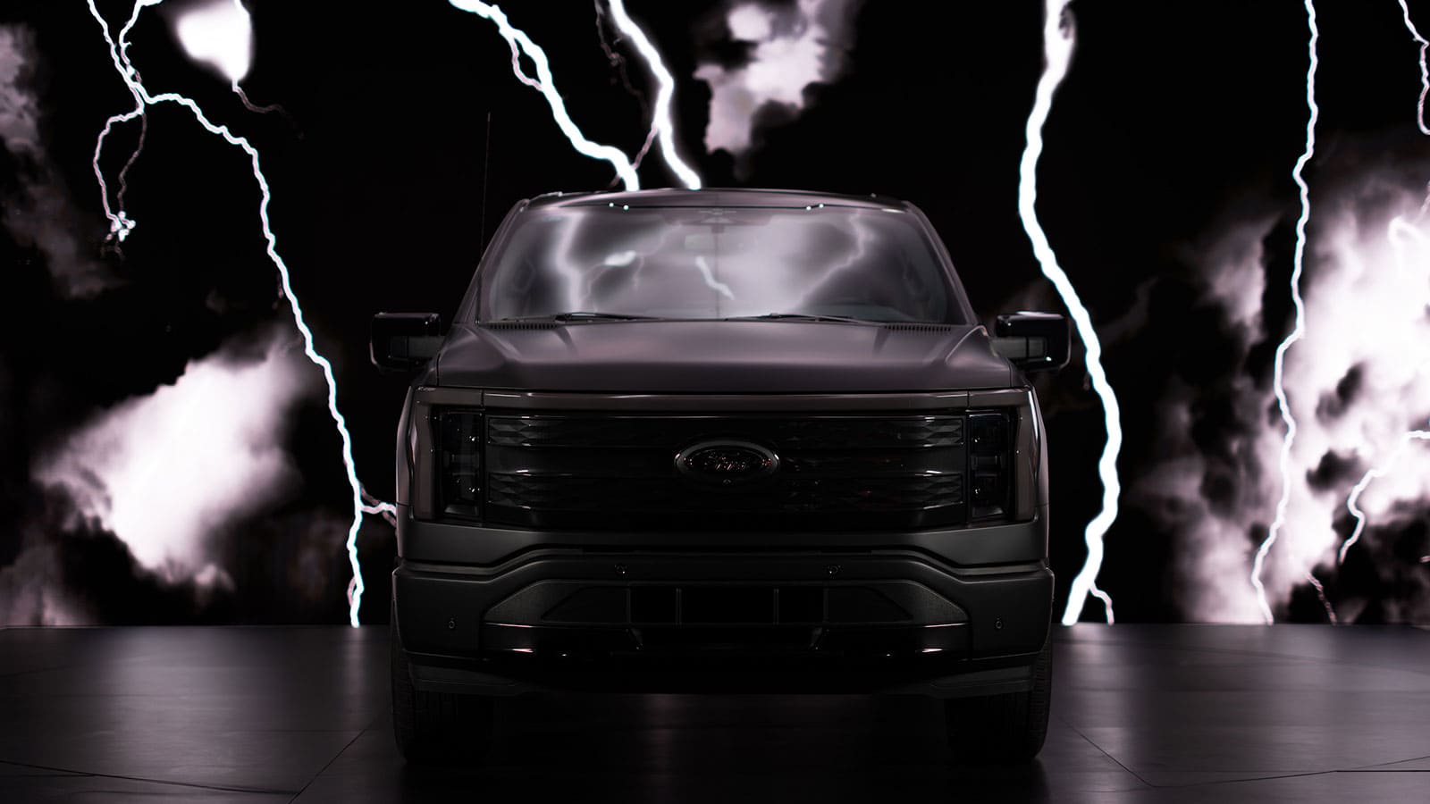 Ford f-150 lightning platinum black front view with lightning background