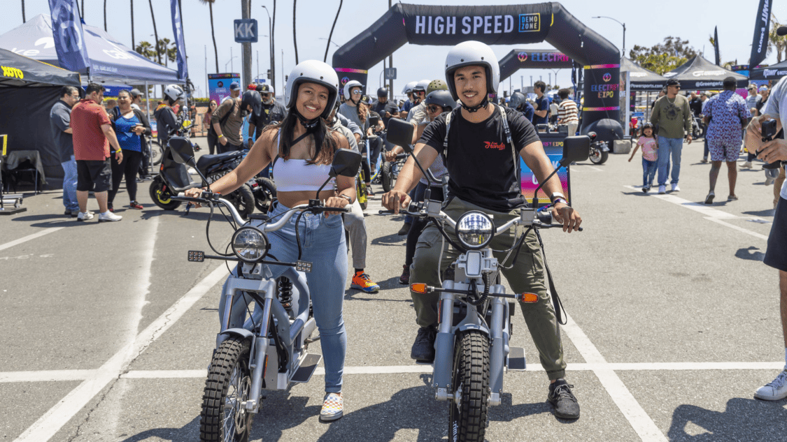 Image showcasing man and woman on a first ride on electric bikes at Electrify Expo