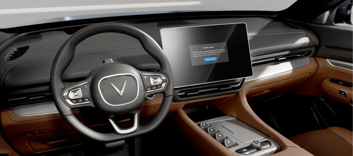 Image showcasing VinFast VF 9 interior seats, steering wheel, and infotainment over the air updates