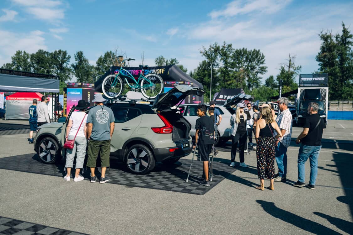Image showcasing attendees at Electrify Expo Seattle looking at the Volvo XC40 features