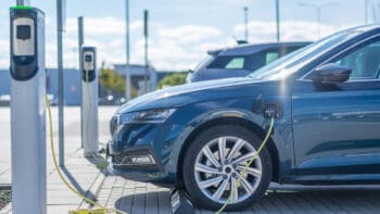 Car charging in a parking lot - Marriott and EV Connect partner to offer guest charging.