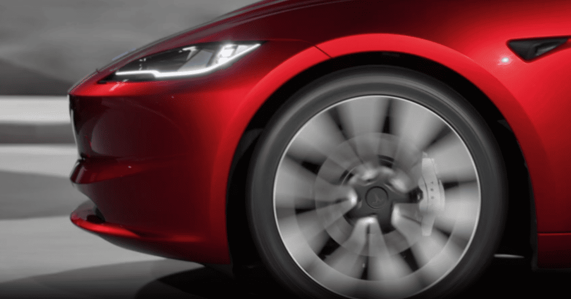 Image showcasing the new Tesla Model 3's sleek exterior redesign with aggressive headlights and cleaner front end, reflecting advanced technology and improved aerodynamics