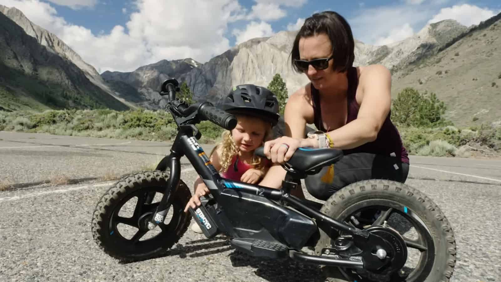 mom and child with one of the best electric bikes for kids, by stacyc.
