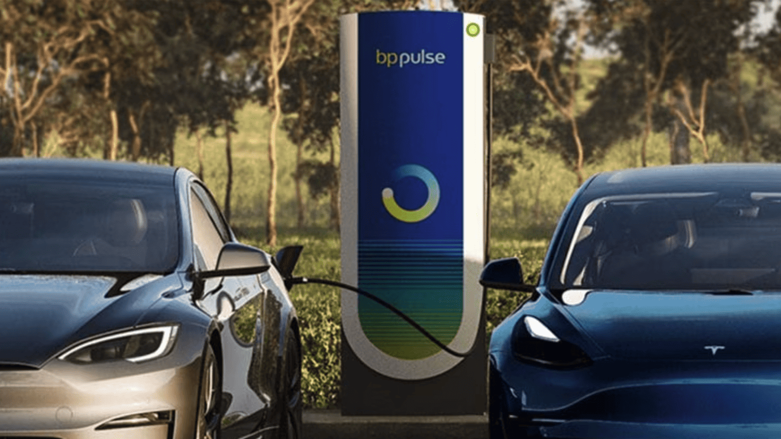 Image showcasing Tesla Model 3 and Model S charging at bp pulse ev charging station