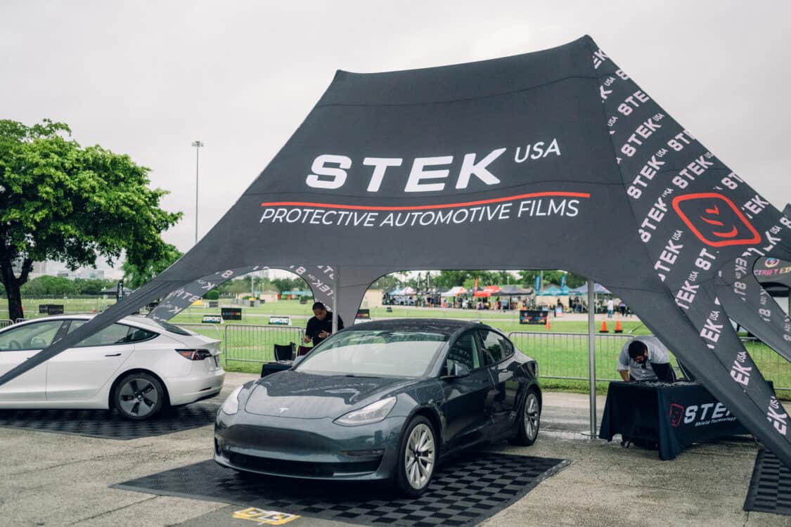 Image showcasing STEK protective paint films (PPF) on a Tesla Model 3 at Electrify Showoff in Miami