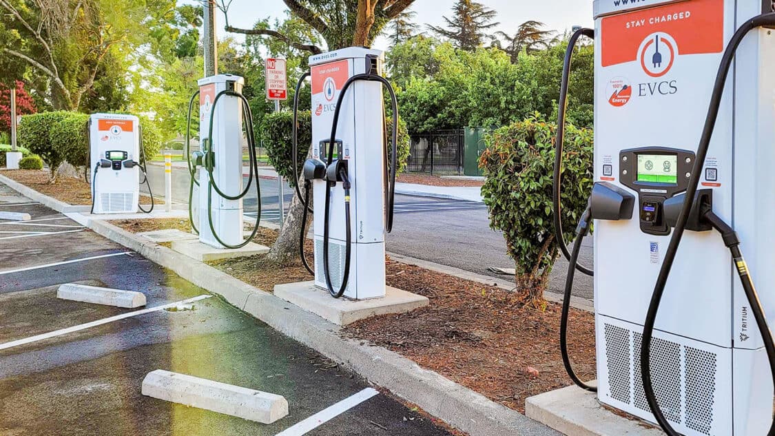 Row of EVCS EV chargers in parking lot, installing in california communities