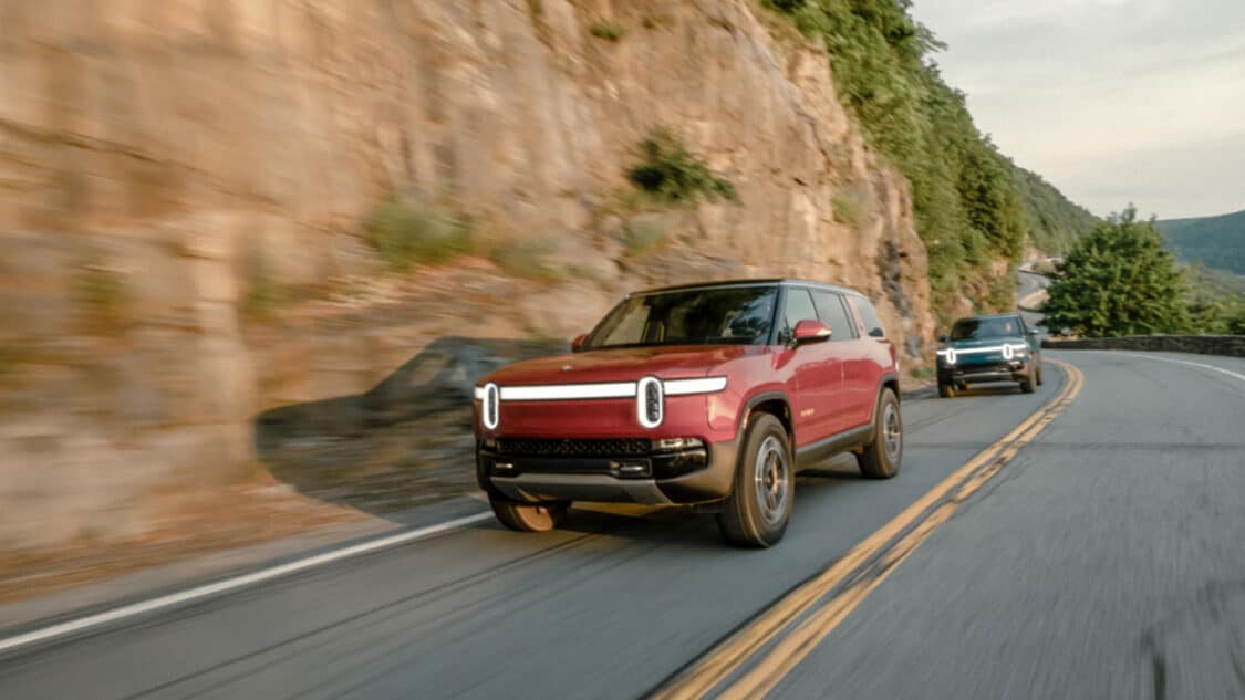 Rivian driving on a cliff-side road California US
