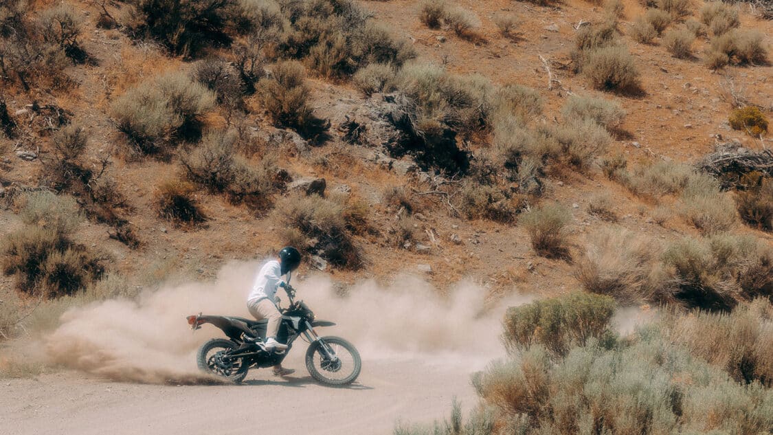 Zero FX kicking up dust on a dirt road, one of the 5 best electric dirt bikes