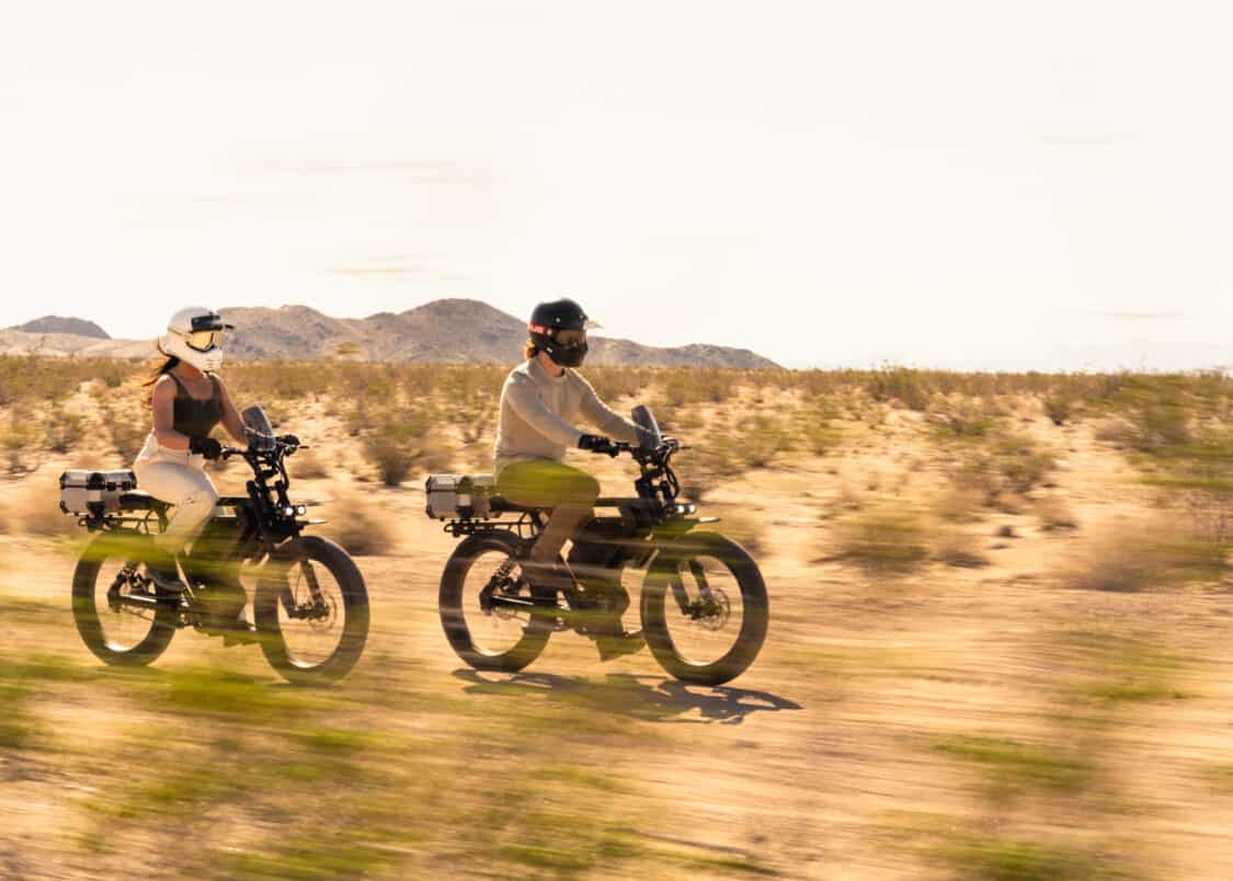 Image showcasing female and male rider wearing helmets in Death Valley on the Ristretto 512 First Edition electric bike