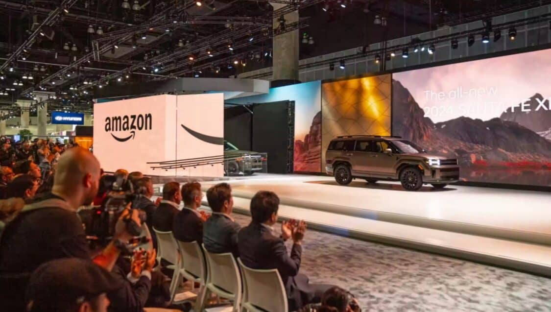 Amazon and Hyundai introduce online vehicle sales with cars driving out of giant amazon box