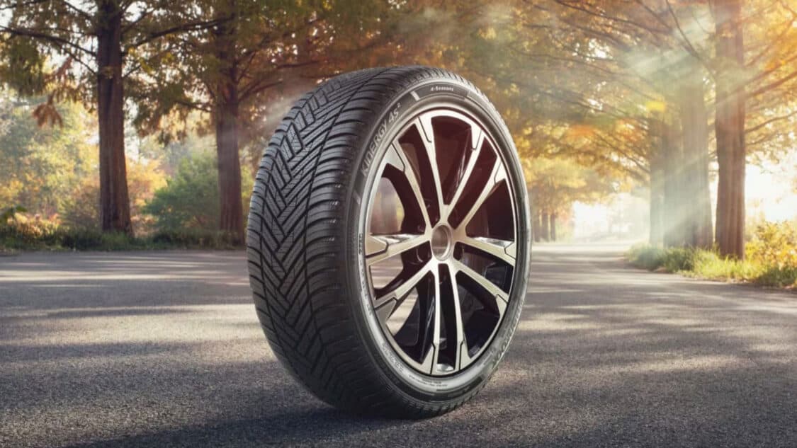 Hanhook tire sitting on road with autumn trees in background, performance test