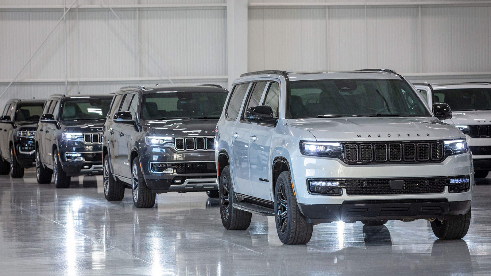 Multiple Jeep Wagoneer parked inside a warehouse, while interest rates affect EV budgets