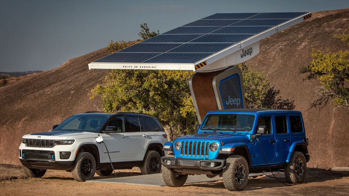Solar panel charging two Jeep EVs to lower carbon footprint