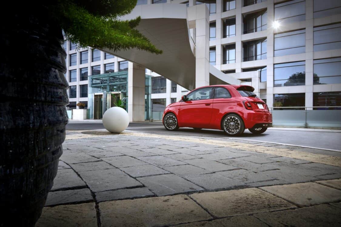 Image showcasing rear driver quarter profile of the 2024 Fiat 500e RED edition