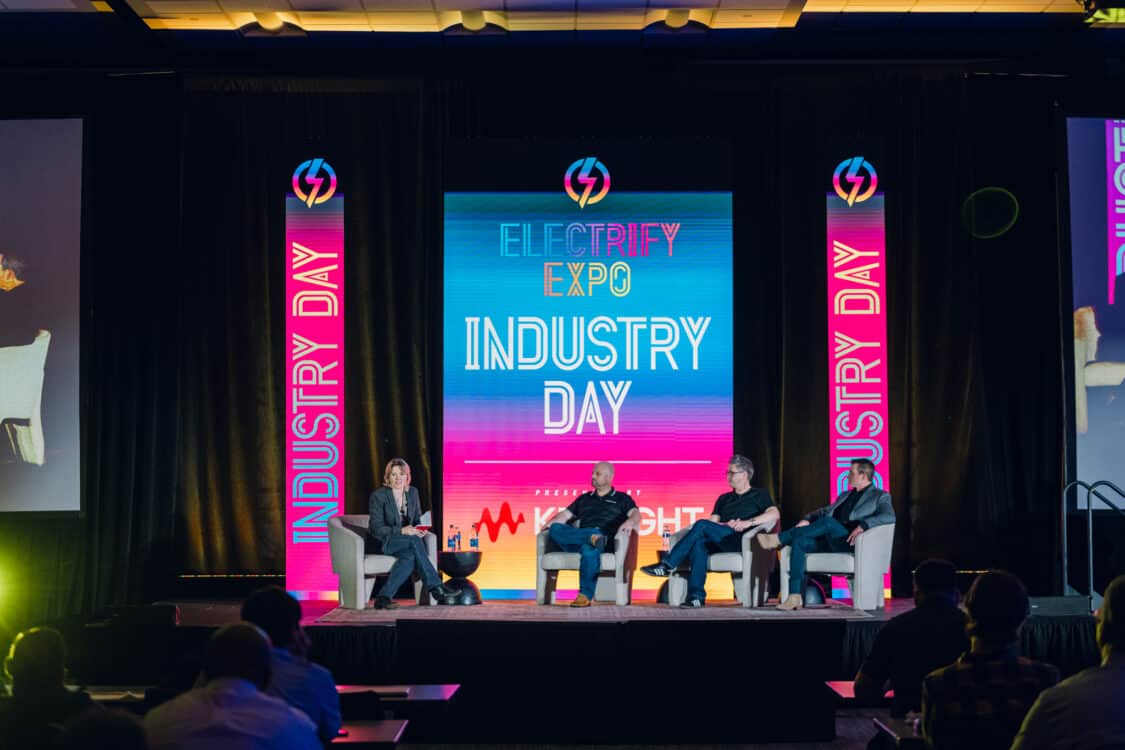 Image showcasing Kathryn, Adam, Matt and BJ on a panel at Electrify Expo Industry Day in Austin, TX discussing Electric Vehicle Marketing Strategies