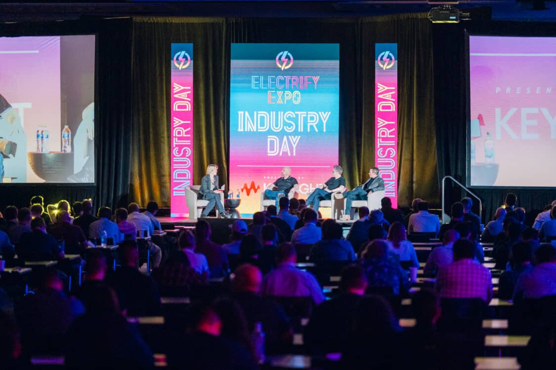 Image showcasing Kathryn, Adam, Matt and BJ on a panel at Electrify Expo Industry Day in Austin, TX discussing Electric Vehicle Marketing Strategies