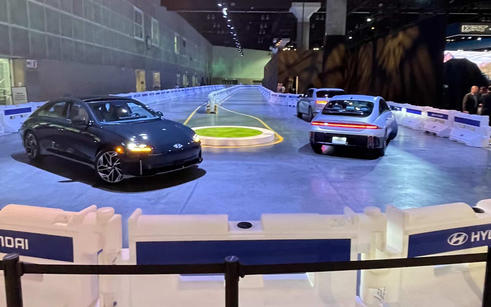 Image showcasing Hyundai IONIQ 5 and 6 on indoor test course at 2023 LA Auto Show