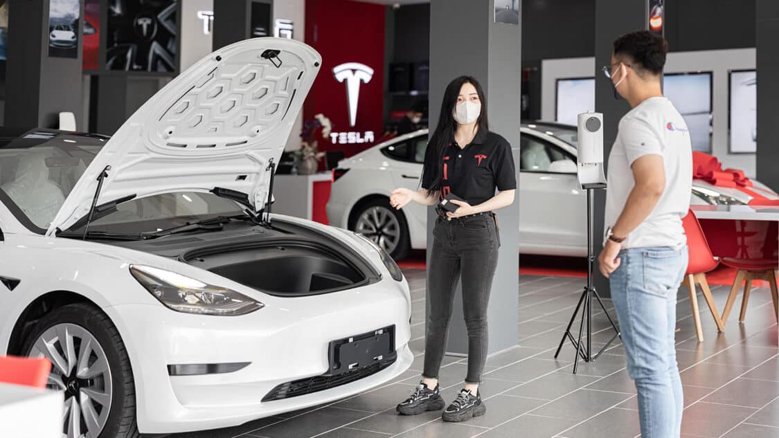 Tesla dealerships, showing electric vehicle with front hood open